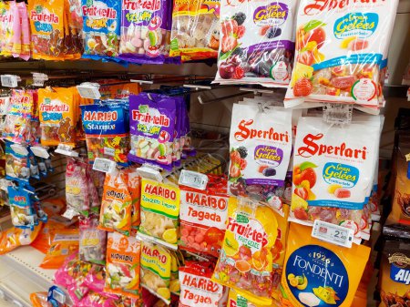 Photo for Rome, Italy  January 17, 2024: Bags of sweets Candies, Haribo and Fruittella, on a shelf in a supermarket - Royalty Free Image