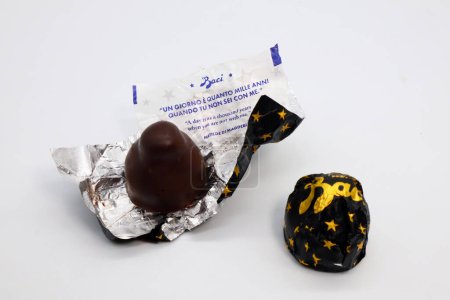 Photo for Rome, Italy - March 31, 2024: Baci Perugina Chocolate with hazelnut grains and whole hazelnut coated by dark chocolate and contains a love note message - Royalty Free Image