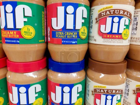 Photo for Los Angeles, California - May 9, 2024: JIF Peanut Butter Spread jars on a shelf in a supermarket. JIF is a brand of The J.M. Smucker Company - Royalty Free Image