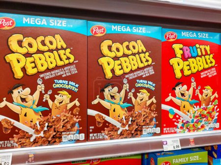 Photo for Los Angeles, California - May 9, 2024: POST Cereals, Cocoa Pebbles and Fruity Pebbles on a shelf in a supermarket. Post Consumer Brands is an American consumer packaged goods food - Royalty Free Image