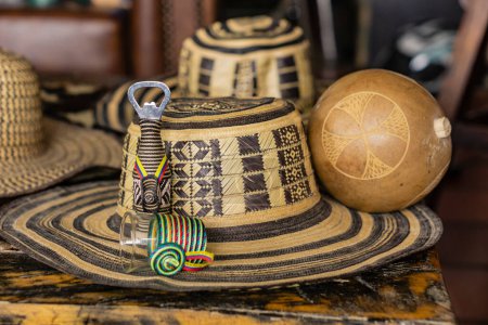 Photo for Traditional Colombian hat "sombrero vueltiao" on a wooden table - Royalty Free Image
