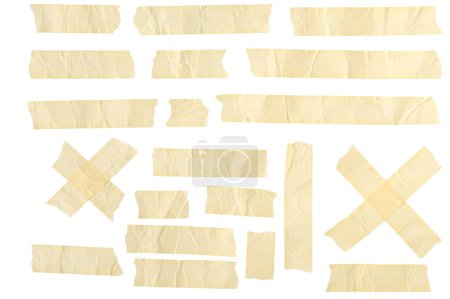 Foto de Esta foto presenta una variedad de cinta adhesiva y tiras adhesivas dispuestas sobre un fondo blanco liso. Se muestran varias longitudes de cinta adhesiva de color beige. - Imagen libre de derechos