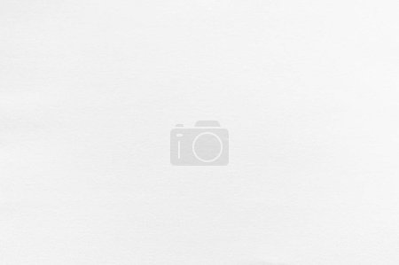 Photo for Close-up of smooth yet lightly textured whatman paper backdrop captures its pristine blankness, awaiting new patterns and designs. This magnified view invites closer examination of the untouched paper surface. - Royalty Free Image