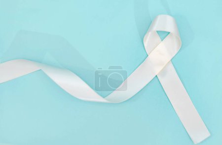Photo for Lung cancer awareness month with white ribbon. Healthcare and medicine concept. - Royalty Free Image