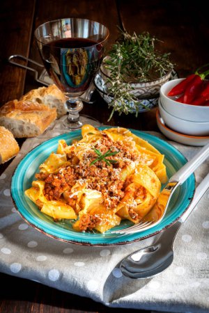 Photo for Homemade pappardelle with meat sauce on the plate - Royalty Free Image