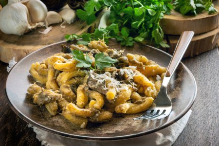 Foto de Homemade pasta with artichoke sauce on the plate - Imagen libre de derechos