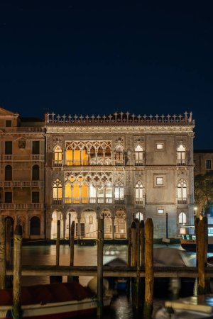 Photo for Venice, Italy: Palazzo Ca' D'oro overlooking the Grand Canal in the evening - Royalty Free Image