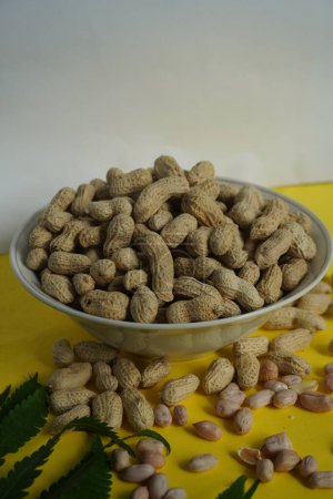 Photo for Peanuts. A bowl of roasted Peanuts is ready to be consumed. These foods contain the minerals Calcium and Phospor which are quite high. - Royalty Free Image
