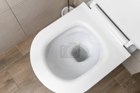Top view of the new white ceramic toilet in a modern toilet