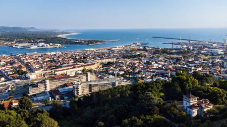 Aerial view of the city of Viana do Castelo, the Limia River, the port, and the Atlantic Ocean. Evening. Alto Mino, Portugal.