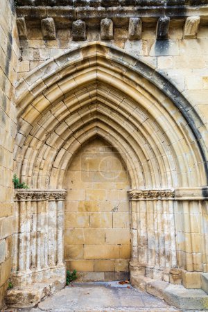 The abandoned medieval church portal with an archivolt. Church of Santa Mara de los Reyes, Laguardia, Alava, Basque Country, Spain.