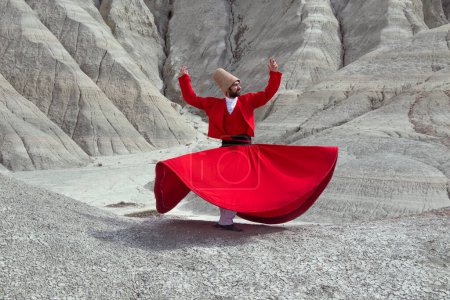 Photo for Man whirling at the mountains. Sufi whirling (Turkish: Semazen) is a form of Sama or physically active meditation which originated among Sufis. - Royalty Free Image