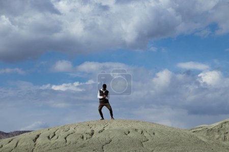 Photo for Black young dancer man on mountain - Royalty Free Image