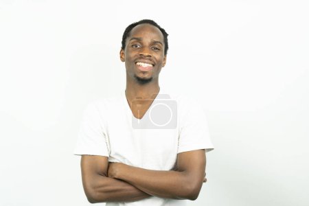 Photo for Portrait of a young african american man with crossed arms against white background - Royalty Free Image