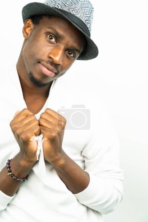Photo for Portrait of a young african american man wearing a hat against white background - Royalty Free Image