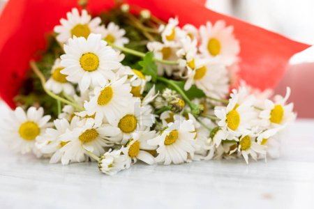 Photo for Bouquet of daisies on the table. Pharmacy chamomile. - Royalty Free Image