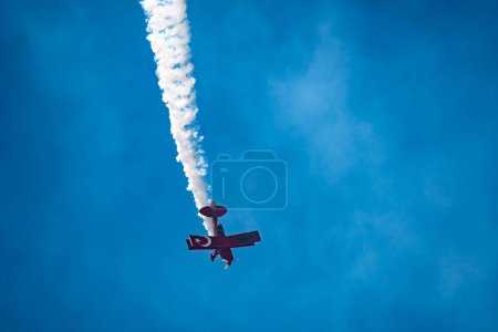 Photo for Aircraft performing aerobatics at airshow - Royalty Free Image