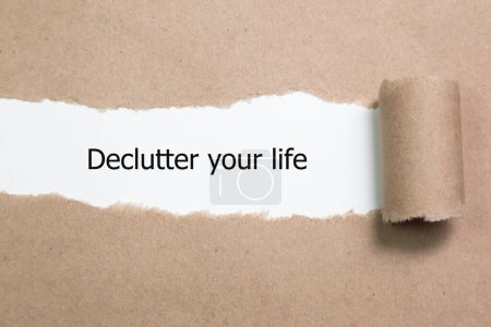 Photo for Declutter your life word written under torn paper. - Royalty Free Image