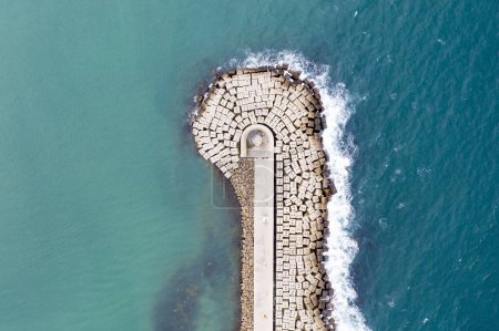 Photo for Aerial view of the sea stone breakwater. Beautiful ocean wallpaper for tourism and advertising. - Royalty Free Image