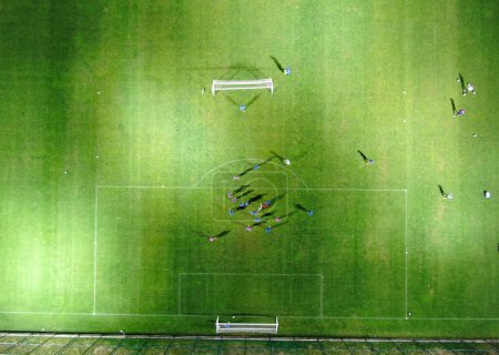 Photo for Aerial Top Down View of Soccer Football Field and Two Professional Teams Playing. - Royalty Free Image