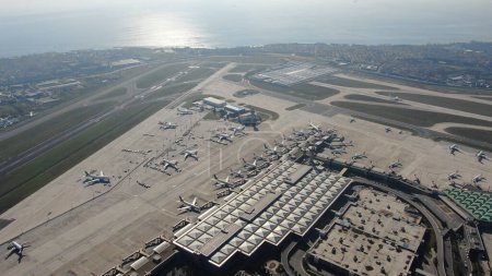 aerial view of airport terminal with parked airplanes