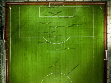 Photo for Aerial Top Down View of Soccer Football Field and Two Professional Teams Playing. - Royalty Free Image