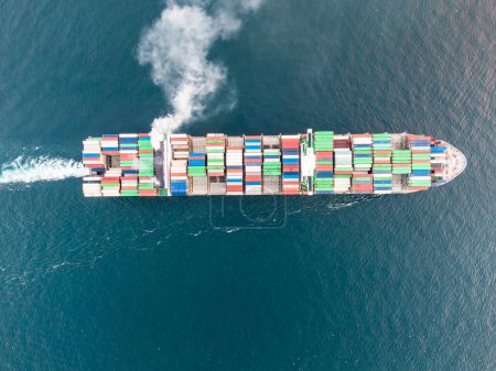 cargo maritime ship with contrail in the ocean ship carrying container and running for export concept technology freight shipping by ship forwarder mast