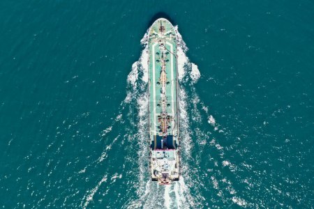Photo for Commercial voyage of a large cargo ship in the ocean. aerial view of cargo ship - Royalty Free Image