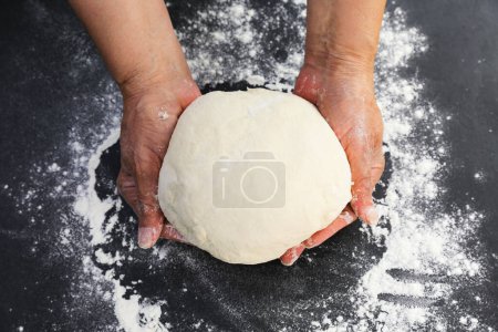 Photo for Female chef making dough for baking, close up - Royalty Free Image