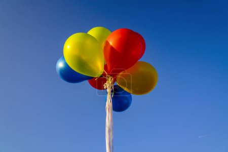 Photo for A bunch of balloons in the air with a blue sky in the background - Royalty Free Image
