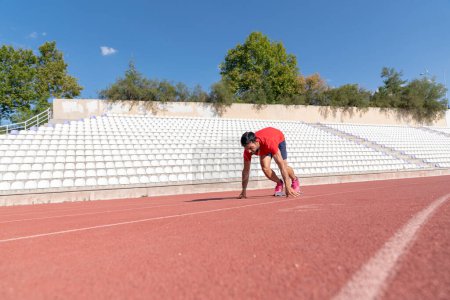 Photo for Stadium, man running and start block of athlete on a runner and arena track for sprint - Royalty Free Image