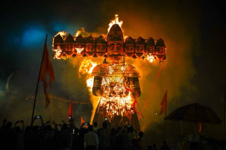 Photo for Ravan Dahan, according to Hindu culture, Effigies of Ravana are burned on Vijayadashami, in India at many places, Ravana burning in dussehra festival, crowd or people taking picture with smartphone - Royalty Free Image