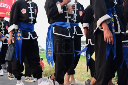 Photo for Tuban Indonesia August 29, 2023, Teenagers wearing pencak silat custome in commemoration of the 78th Anniversary of the Republic of Indonesia at Dasin Village Tambakboyo district. - Royalty Free Image