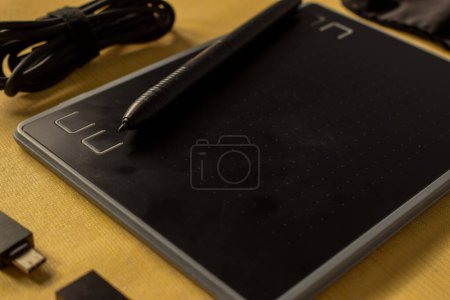 Photo for Electronic drawing pen tablet and stylus close up isolated yellow - Royalty Free Image