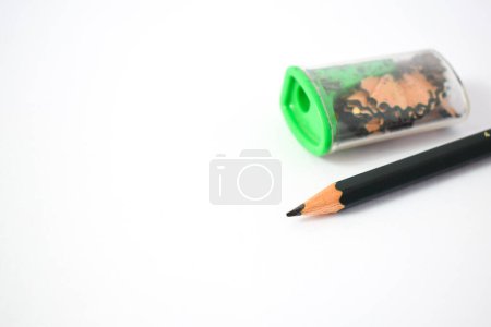 Photo for Green pencil sharpener and dark green pencils on white background - Royalty Free Image