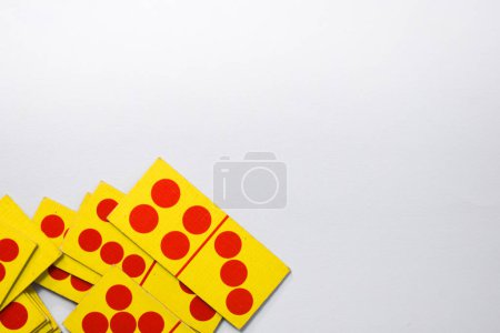 Photo for Dominoes playing cards isolated white background, yellow red dominoes cards - Royalty Free Image