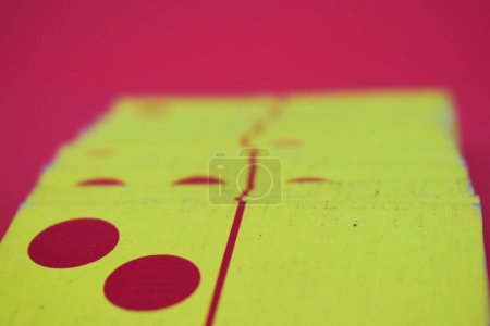 Photo for Dominoes playing cards isolated red background, yellow red dominoes cards - Royalty Free Image