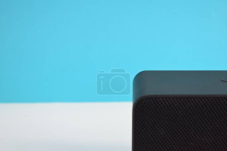 Photo for Wireless black Speaker box for play music on blue background, Wireless Music player, electronic. - Royalty Free Image