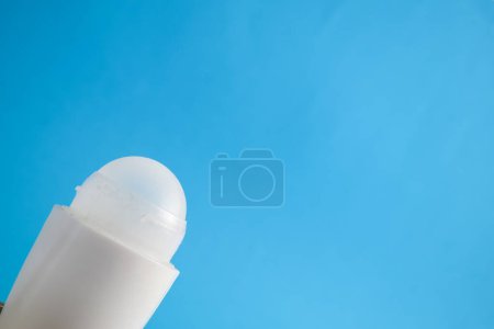 Photo for White bottle deodorant blank for mock up on blue background, product mock up, armpit health care, body care - Royalty Free Image