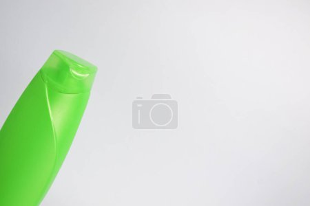 Photo for Green blank bottle shampoo minimalist bakcground, hair care bottle mock up product. - Royalty Free Image