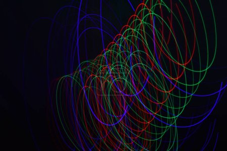 Photo for Long exposure colorful abstract line painting background isolated on black. curvy lines from led strip lighting on black background - Royalty Free Image