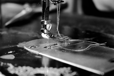 Photo for Vintage Black and White Close up Sewing machine and thread, vintage black and white concept - Royalty Free Image