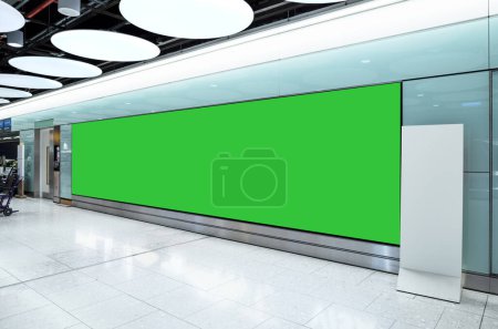 Photo for Very wide billboard display mock up screen at airport hall. Clipping path included. - Royalty Free Image