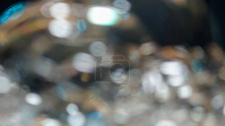 Téléchargez les photos : Background texture of Defocused soap bubbles isolated in black background - en image libre de droit