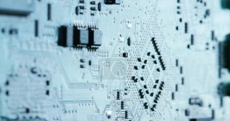 Photo for A close up of a computer motherboard with intricate electronics arranged in a pattern resembling a tree design. The monochrome image focuses on - Royalty Free Image