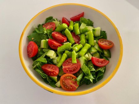 Photo for The famous Aegean salad of Turkish cuisine, consisting of tomatoes, arugula, cucumbers and peppers. High quality photo - Royalty Free Image