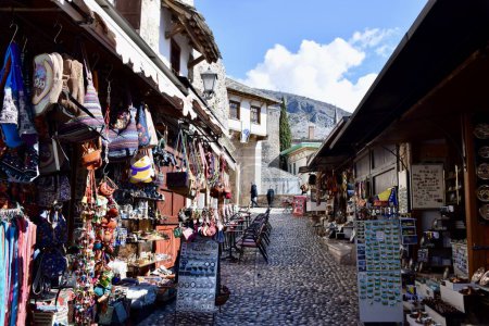 Photo for Mostar, Bosnia and Herzegovina. March 2020. Colourful buildings, street scene, shops and restaurants. On the River Neretva. - Royalty Free Image