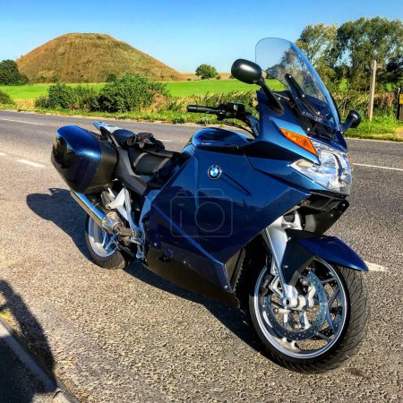 Photo for Blue 2008 BMW K1200GT Motorcycle parked in a Wiltshire Lay-by nect to Silbury Hill, Wiltshire, UK, September 1, 2019. - Royalty Free Image
