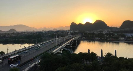 Photo for The Jiefang bridge over Li River at Sunrise with The Karst Mountains behind. Guilin, Guangxi, China. October 29, 2018. - Royalty Free Image