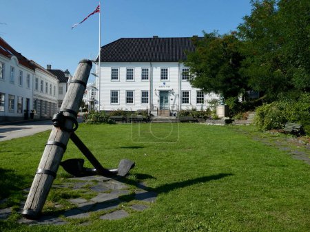 Photo for Lillesand Town Hall, originally the house of Christen the Merchant, built in 1734. Wooden anchor outside. Lillesand, Norway. September 1, 2018. - Royalty Free Image